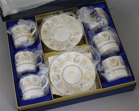 Two boxed sets of Coalport coffee cans and saucers